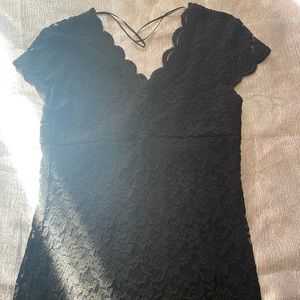 I am selling a lace dress design in size large in the color black.